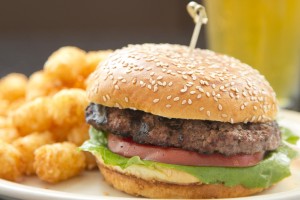 A hamburger and tater tots at the Village Inn