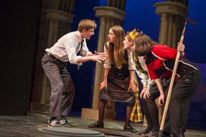 Students acting in a play on stage