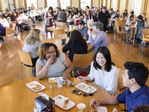 Students eating and laughing in Thomas Hall