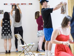 Students hanging art in the Horn Gallery