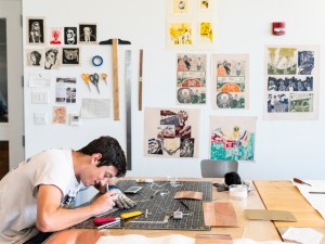 An art major working in his studio in Horvitz Hall