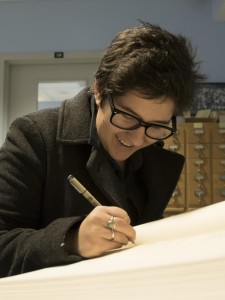 A student signing the matriculation book